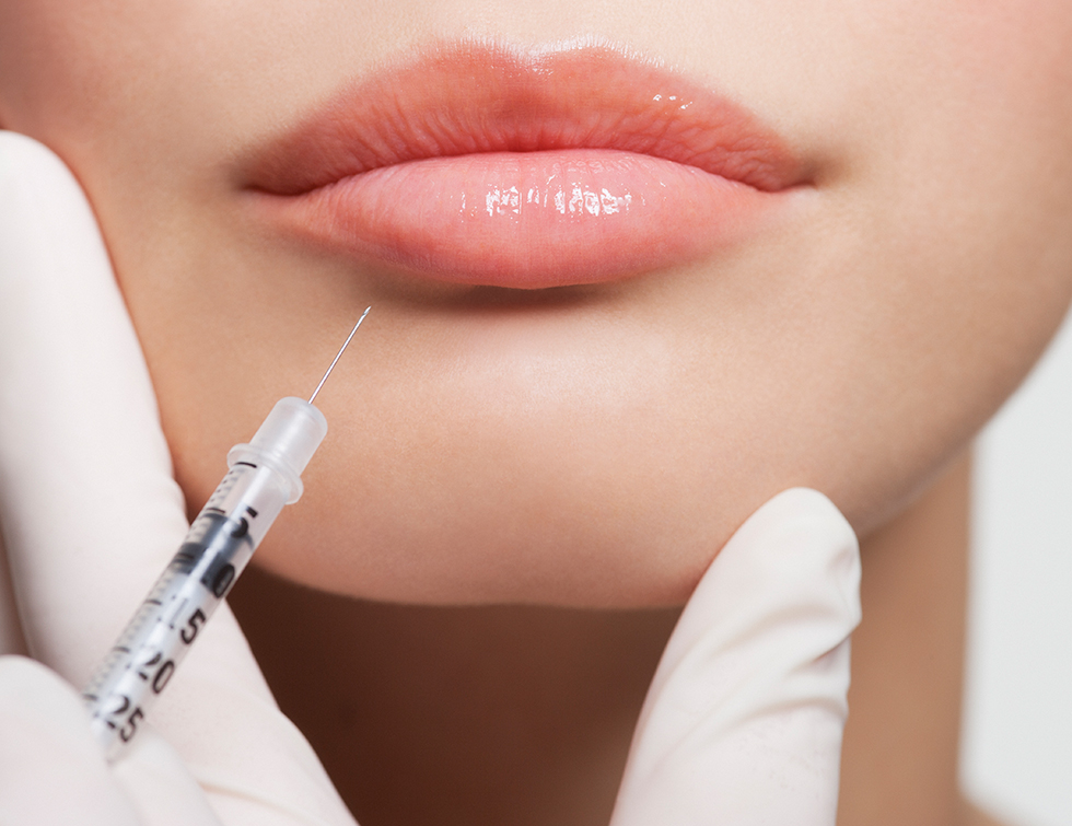 Woman receiving injection with dermal filler treatment